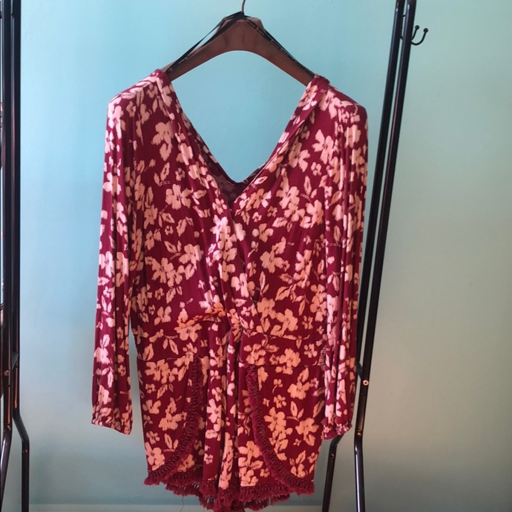 Red floral romper with tassel detailing